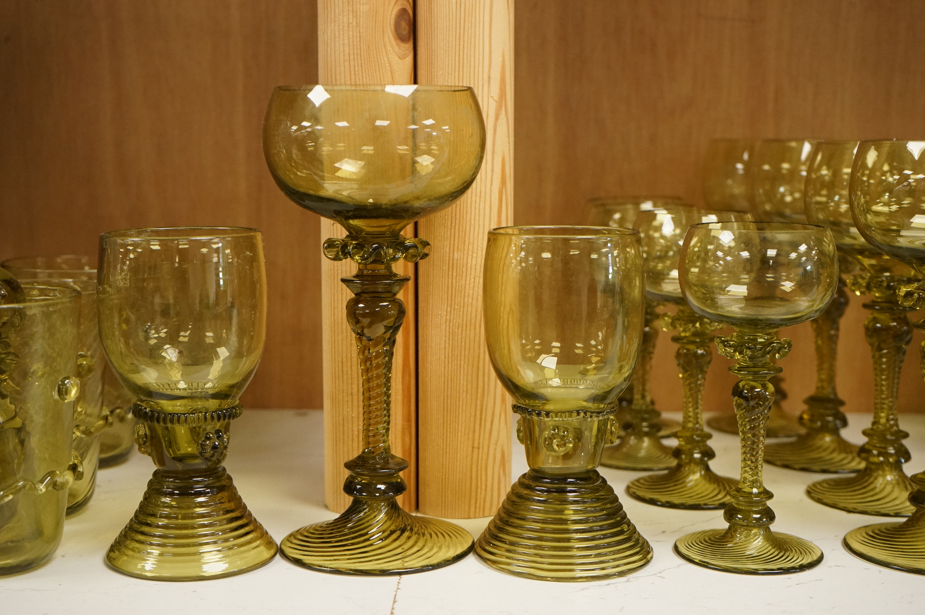 A collection of Continental green glassware to including hock glasses and tumblers, largest 17cm high